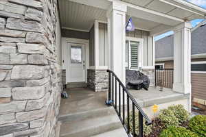 View of exterior entry featuring a porch