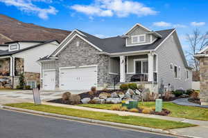 Craftsman-style home featuring a garage