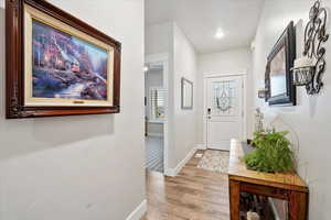 Entrance foyer featuring light hardwood / wood-style flooring