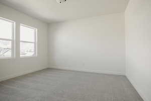 Unfurnished room with carpet flooring