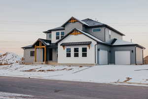 View of front of home featuring a garage