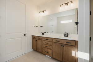 Bathroom featuring vanity and tile patterned floors