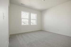 View of carpeted spare room