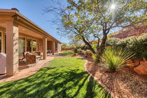 View of yard with a patio area and an outdoor fire pit