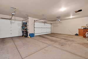 Garage featuring a garage door opener