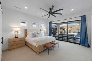 Carpeted bedroom with ceiling fan, a mountain view, and access to outside