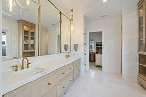 Bathroom featuring vanity and tile patterned floors