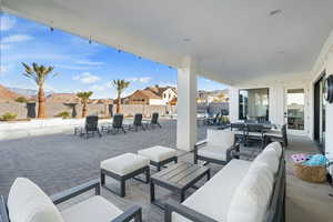 View of patio featuring outdoor lounge area and a mountain view