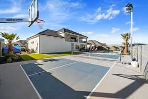 View of sport court with a pool and tennis court