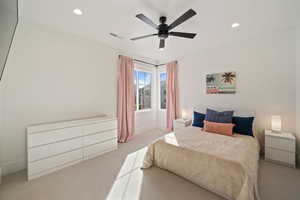 Bedroom featuring ceiling fan and light carpet