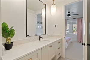 Bathroom with vanity and ceiling fan