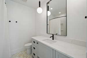 Bathroom with vanity and toilet