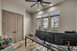 Office area featuring ceiling fan and light wood-type flooring