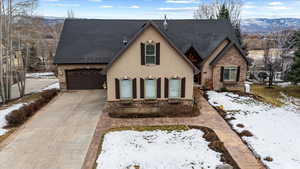 View of front facade featuring a garage and a mountain view