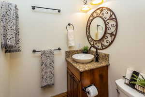 Bathroom featuring vanity and toilet