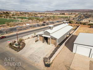 Birds eye view of property with a mountain view