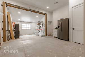 Interior space featuring stainless steel fridge with ice dispenser