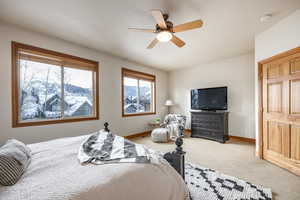 Bedroom featuring carpet and ceiling fan