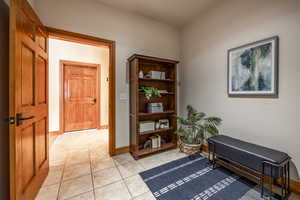 Living area featuring light tile patterned flooring