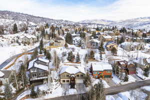 Snowy aerial view featuring a mountain view