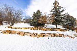 View of yard covered in snow