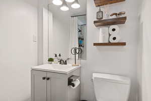 Bathroom with vanity and toilet