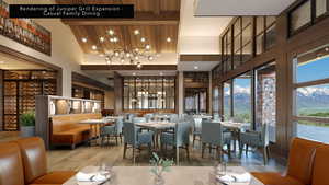 Dining area with a towering ceiling, a chandelier, hardwood / wood-style flooring, a mountain view, and beam ceiling