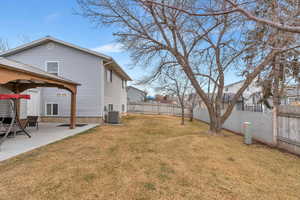 View of yard with a gazebo, central AC unit, and a patio