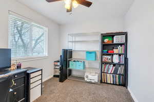 Bedroom or Office area featuring light colored carpet and ceiling fan