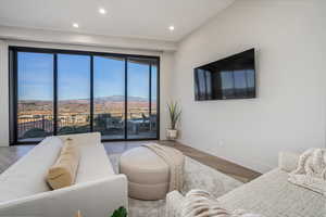 Living room with hardwood / wood-style flooring