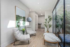 Sitting room with light wood-type flooring