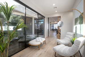 Sitting room featuring light hardwood / wood-style floors