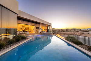 View of pool at dusk