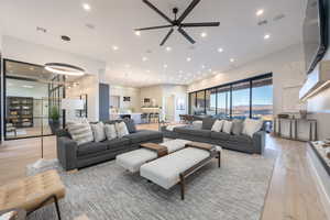 Living room with light hardwood / wood-style floors