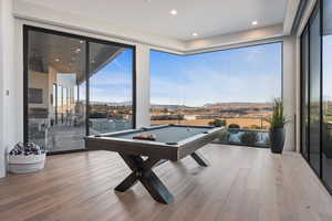 Game room featuring billiards and light hardwood / wood-style flooring