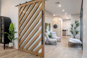 Corridor featuring light hardwood / wood-style flooring