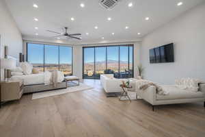 Living room featuring light hardwood / wood-style flooring and ceiling fan