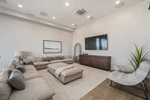 Living room with light wood-type flooring