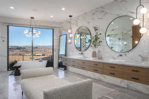 Bathroom with a shower with door and vanity