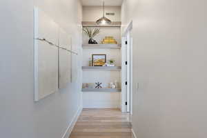 Hall featuring light hardwood / wood-style floors