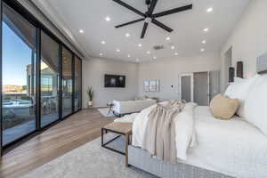 Bedroom featuring light hardwood / wood-style flooring and access to outside