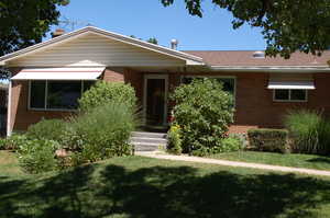 View of front of home with a front yard