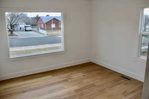 Spare room with light hardwood / wood-style floors