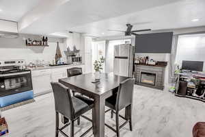 Dining room featuring ceiling fan and sink