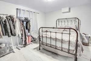 Bedroom with a textured ceiling