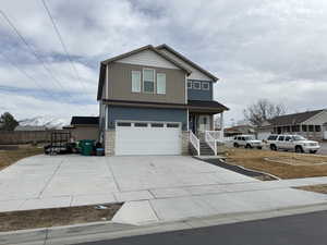 View of property with a garage