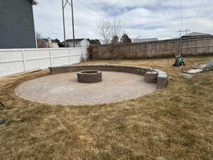 View of patio / terrace featuring an outdoor fire pit