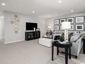 Living room featuring light carpet
