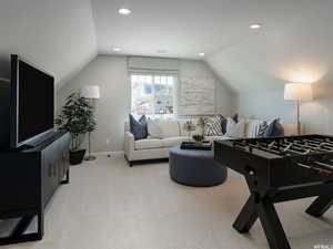Rec room featuring vaulted ceiling and light colored carpet