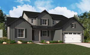 View of front of house with a garage and a front yard